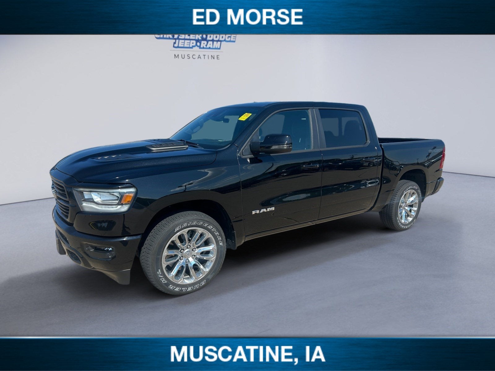 2023 RAM 1500 Laramie in Diamond Black Crystal Pearlcoat — front three-quarter view