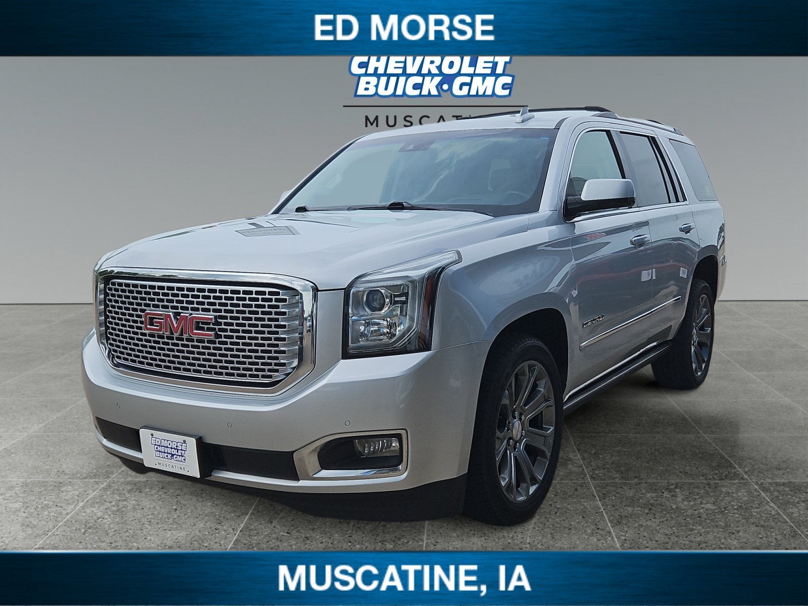 2016 GMC Yukon Denali in Quicksilver Metallic — front three-quarter view