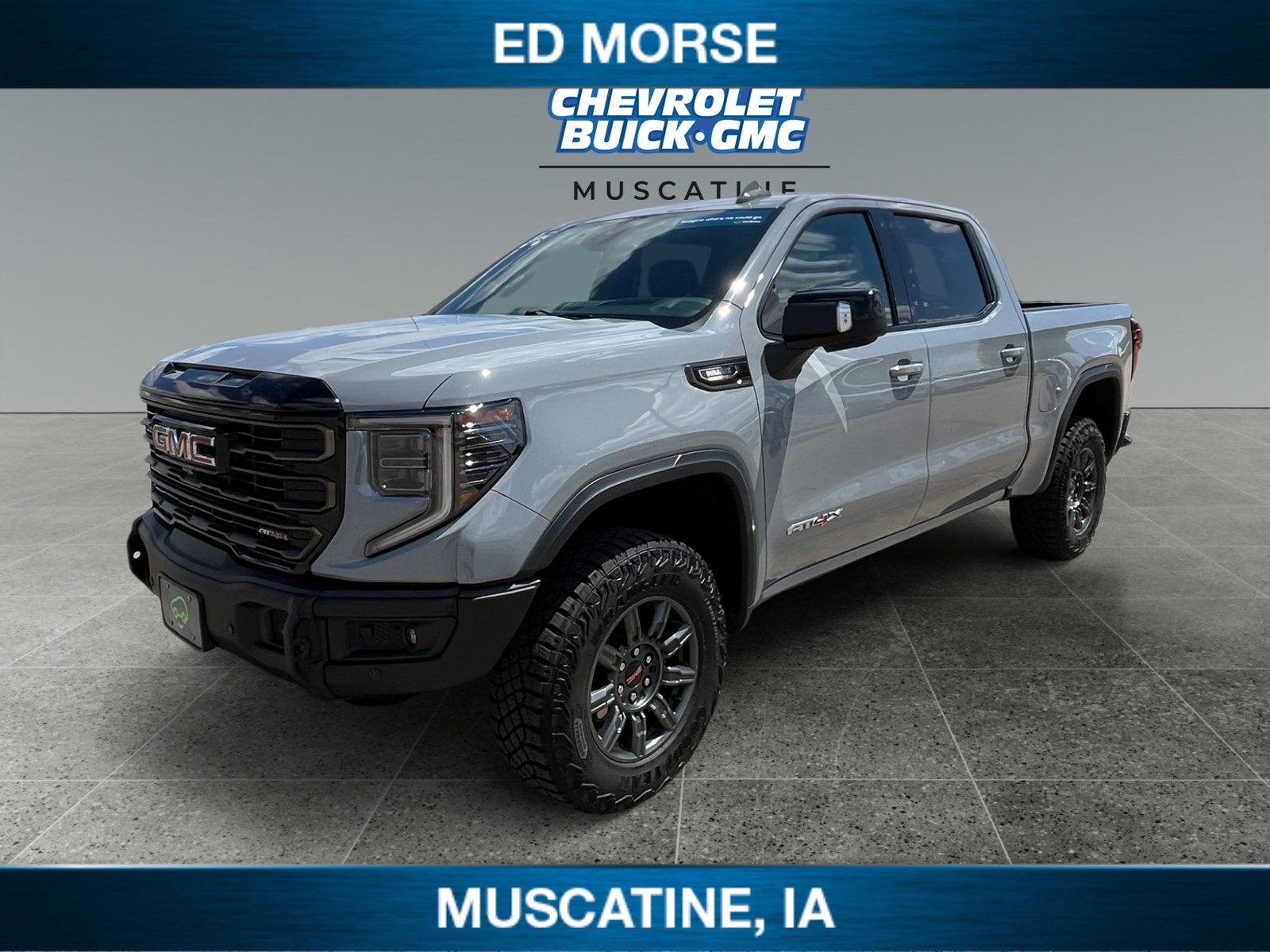 2024 GMC Sierra 1500 AT4X in Thunderstorm Gray — front three-quarter view